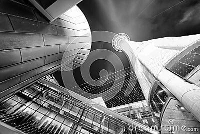 Skyward view of city skyscrapers and tower at night, Auckland - Stock Photo