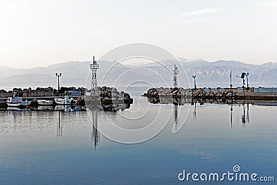 Slack Water, Small Gulf of Corinth Village Harbour, Greece Editorial Stock Photo