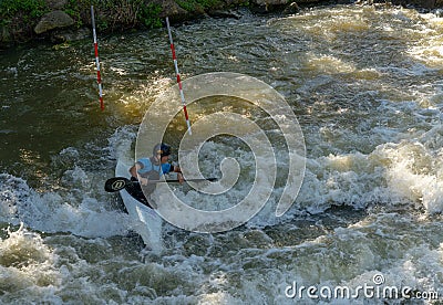 Slalom kayaker training on the Digue de la Pucelle slalom course in the city center of Metz Editorial Stock Photo