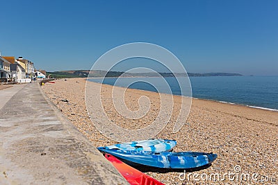 Slapton Sands beach Devon England UK, from Torcross in direction of Dartmouth with canoes Stock Photo