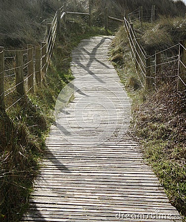 A wooden slatted walkway over the dunes Stock Photo