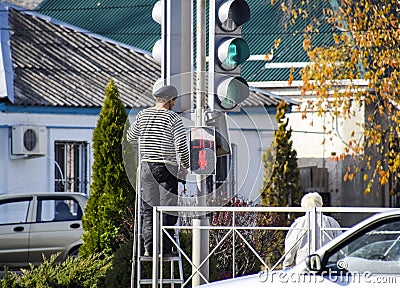 Electrical repairs traffic light at the intersection. Broken tra Editorial Stock Photo