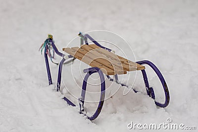 Sledges on the snow. Children`s sledges on a snowy trail in the Stock Photo
