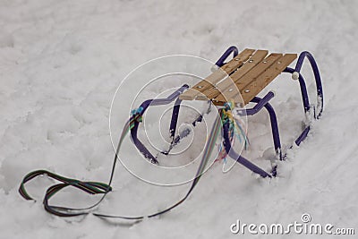 Sledges on the snow. Children`s sledges on a snowy trail in the Stock Photo