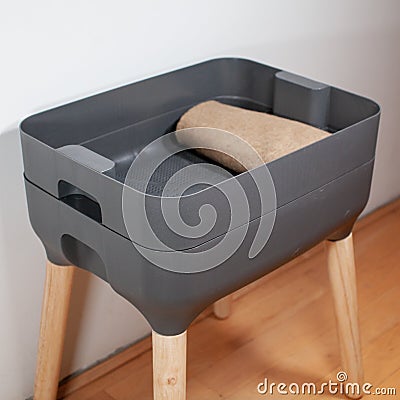A sleek, modern looking indoor worm composter is the perfect solution for apartment living Stock Photo