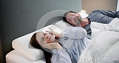 Sleep Apnea Snoring Disturbance. Angry Woman Stock Photo