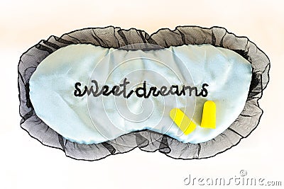 Sleep mask on white Sweet dreams ear plugs Stock Photo