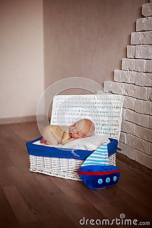 Sleeper newborn baby in white box Stock Photo