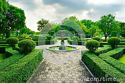 Sleepiness fountain in middle of crushed rock road Stock Photo