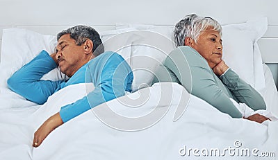 Sleeping, fighting and a senior couple in a bed with insomnia in a marriage together. Conflict, tired and elderly man Stock Photo