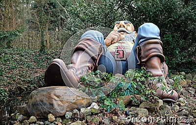 The sleeping giant in the fairy tale Little Thumb in the fairytale forest in the theme park Efteling in the Netherlands Editorial Stock Photo