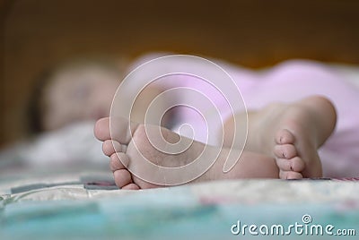 Sleeping Little Girl with Feet in focus Slumbering Napping Stock Photo