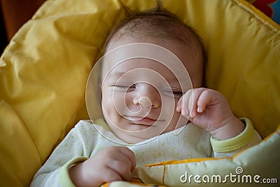 Sleeping smiling newborn baby Stock Photo