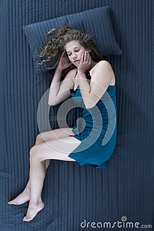 Sleeping woman in nightgown Stock Photo