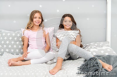 Sleepover time for fun gossip story. Best friends forever. Soulmates girls having fun bedroom interior. Childhood Stock Photo