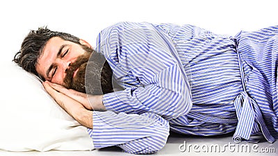 Sleeps like baby concept. Guy sleeps, puts hands under cheek. Stock Photo