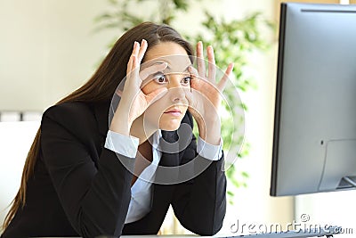 Sleepy businesswoman trying to keep eyes opened Stock Photo