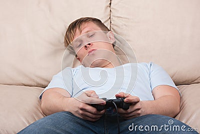 Sleepy gamer Stock Photo