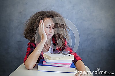 Sleepy teen girl resting from learning Stock Photo