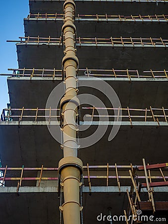 Sleeve for dumping debris at a construction site Down up. View from below. Frame of a concrete structure Stock Photo
