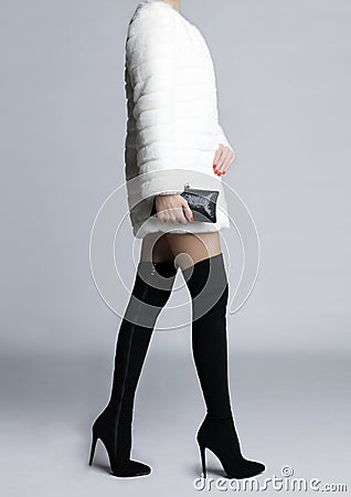 Slender female legs in boots stockings Stock Photo