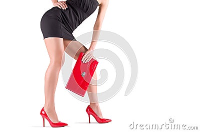 Slender legs in red shoes Stock Photo
