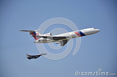 Sliac, Slovakia - August 27, 2011: Flight display of jet airliner Tupolev Tu-154M escorted by jet air figh Editorial Stock Photo