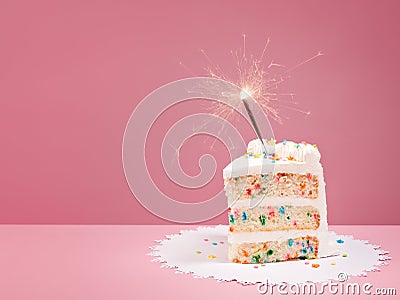 Slice of Birthday Cake with Sparkler Stock Photo