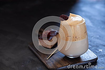 Slice of cheesecake and glass of whipped iced coffee Stock Photo