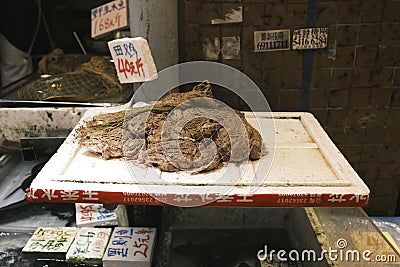 Slice of Chinese edible frog meat being sold in a Hong Kong Market Editorial Stock Photo