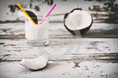 Slice of coconut over an old table Stock Photo