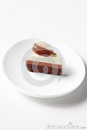 Slice of Contemporary Three Chocolate Mousse Cake Stock Photo