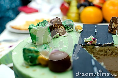 Slice delicious cake with candy. Celebration of children`s birthday Stock Photo