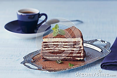 Slice of delicious chocolate cake on silver plate Stock Photo