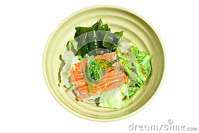 Slice green oak and cabbage topping crab stick couple fresh seaweed with shrimp egg dressing Japanese sesame soy sauce salad on bo Stock Photo