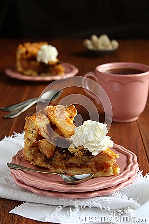 Slice of homemade dutch apple cake with whipped cream Stock Photo
