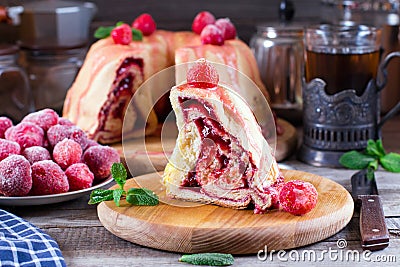 A slice of homemade yeast pie with jam Stock Photo