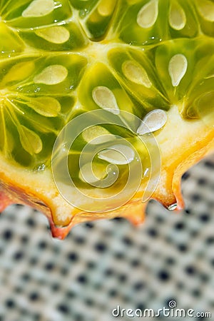 Slice of Kiwano, exotic vegetable cucumis metuliferus close-up. Soft focus. Vegetarian food Stock Photo