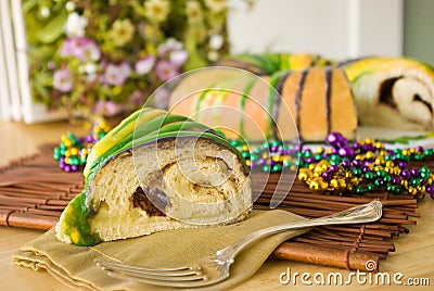 Slice of Mardi Gras King Cake Stock Photo