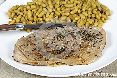 Slice of mutton leg and flageolet beans Stock Photo