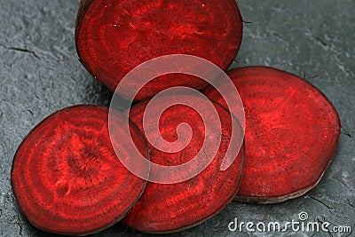 Slice of organic beetroot from rural permaculture Stock Photo