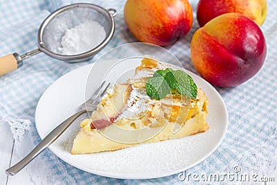 Slice of peach clafoutis Stock Photo