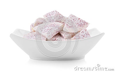 Slice taro root in a bowl on white background Stock Photo