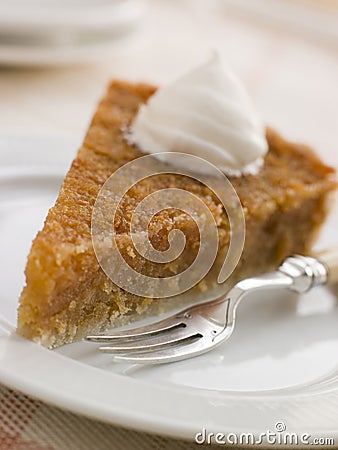 Slice of Treacle Tart with Whipped Cream Stock Photo