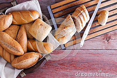 Sliced baguette and rolls on a buffet table Stock Photo