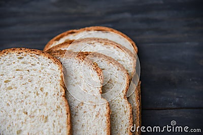 Sliced bread close up top view - Whole wheat bread cut on wooden dark Stock Photo