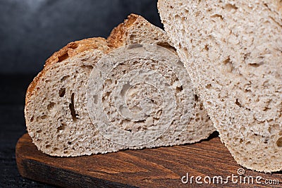 Sliced bread on cutting board. Slices of grain bread Stock Photo