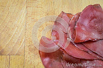 Sliced bresaola, delicious typical italian raw beef salami, close up Stock Photo