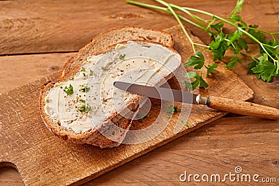 Sliced buttered bread with fresh parsley Stock Photo