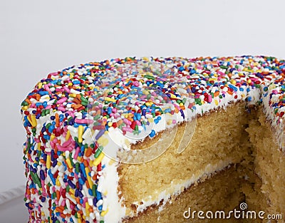 A sliced cake with sprinkles Stock Photo